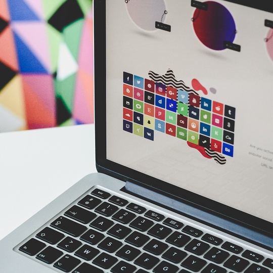 Laptop showing different social media platform icons