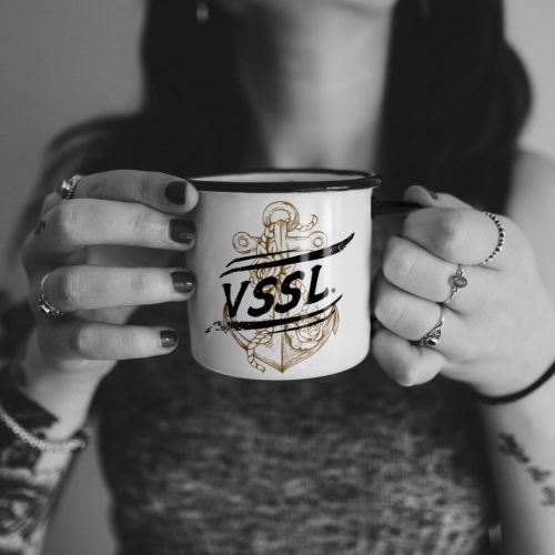 Woman holding VSSL branded mug