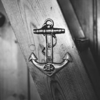 Anchor medallion pegged into wooden board