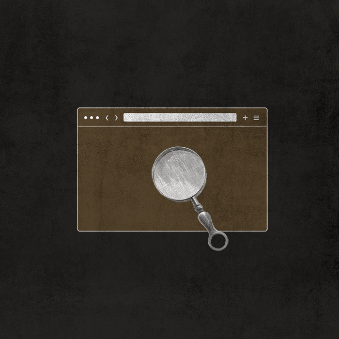 Antique magnifying glass over website browser window